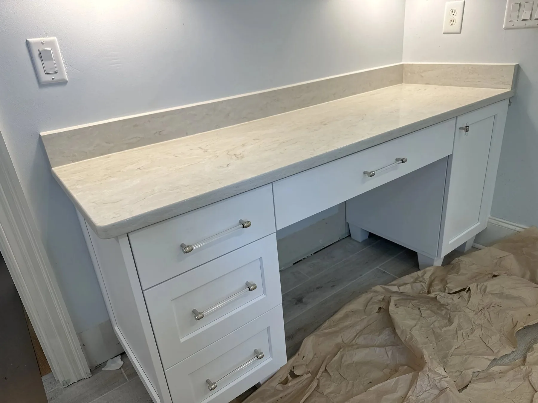 Custom cabinetry being installed in a Wilmington home